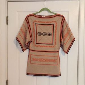 Aztec shirt with unique sleeves.